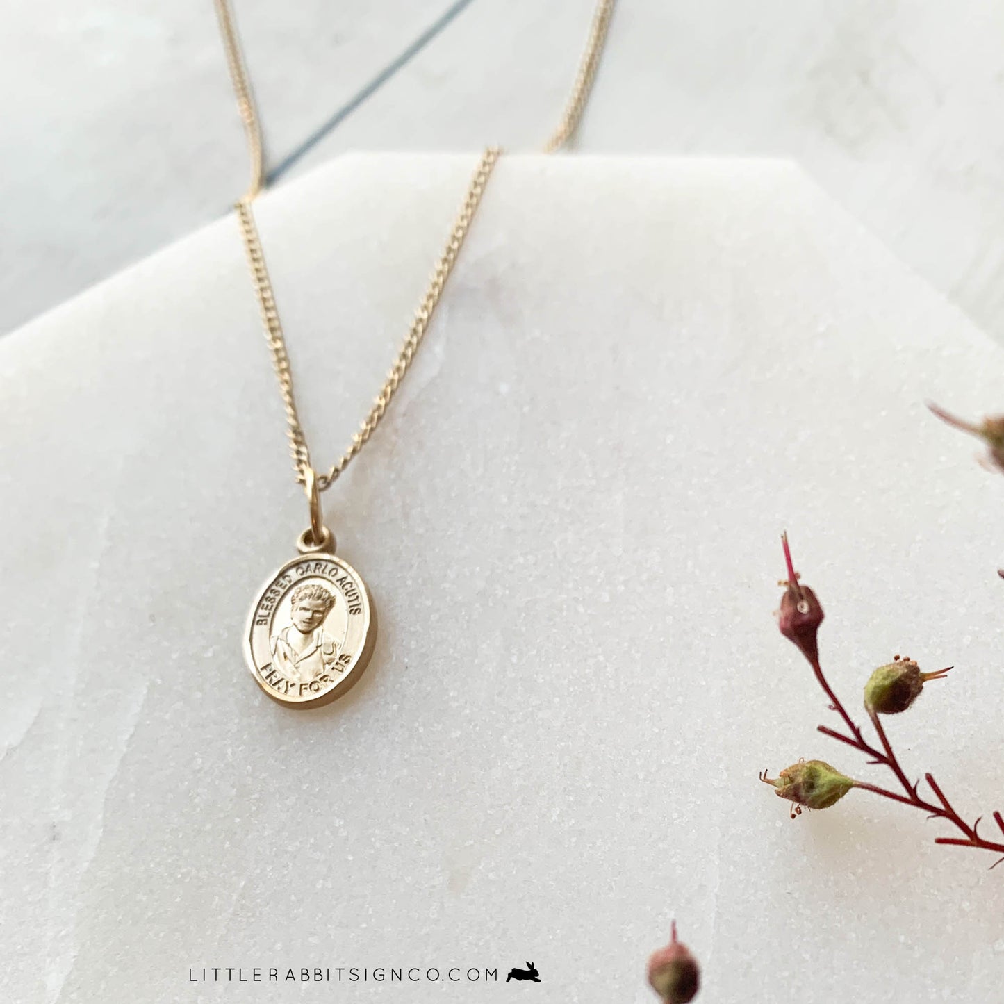 Tiny Gold Filled Blessed Carlo Acutis Necklace on a dainty minimalist gold chain. This teen died of leukemia at the age of 15. He loved Jesus and promoted the Real Presence of the Eucharist on the internet. He is the patron of the internet, computer programmers, and youth. This gold necklace is proudly made in the USA.