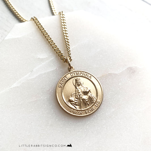 Close up image of a 14kt Gold Filled Saint Dymphna round medal for men. This is a very high quality, heirloom Catholic piece of jewelry. The perfect Catholic gift for dad. 