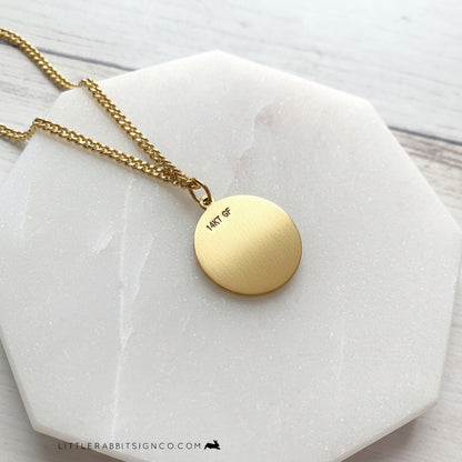 Back of the Men's Saint Dymphna 14kt gold filled necklace on a white background. 