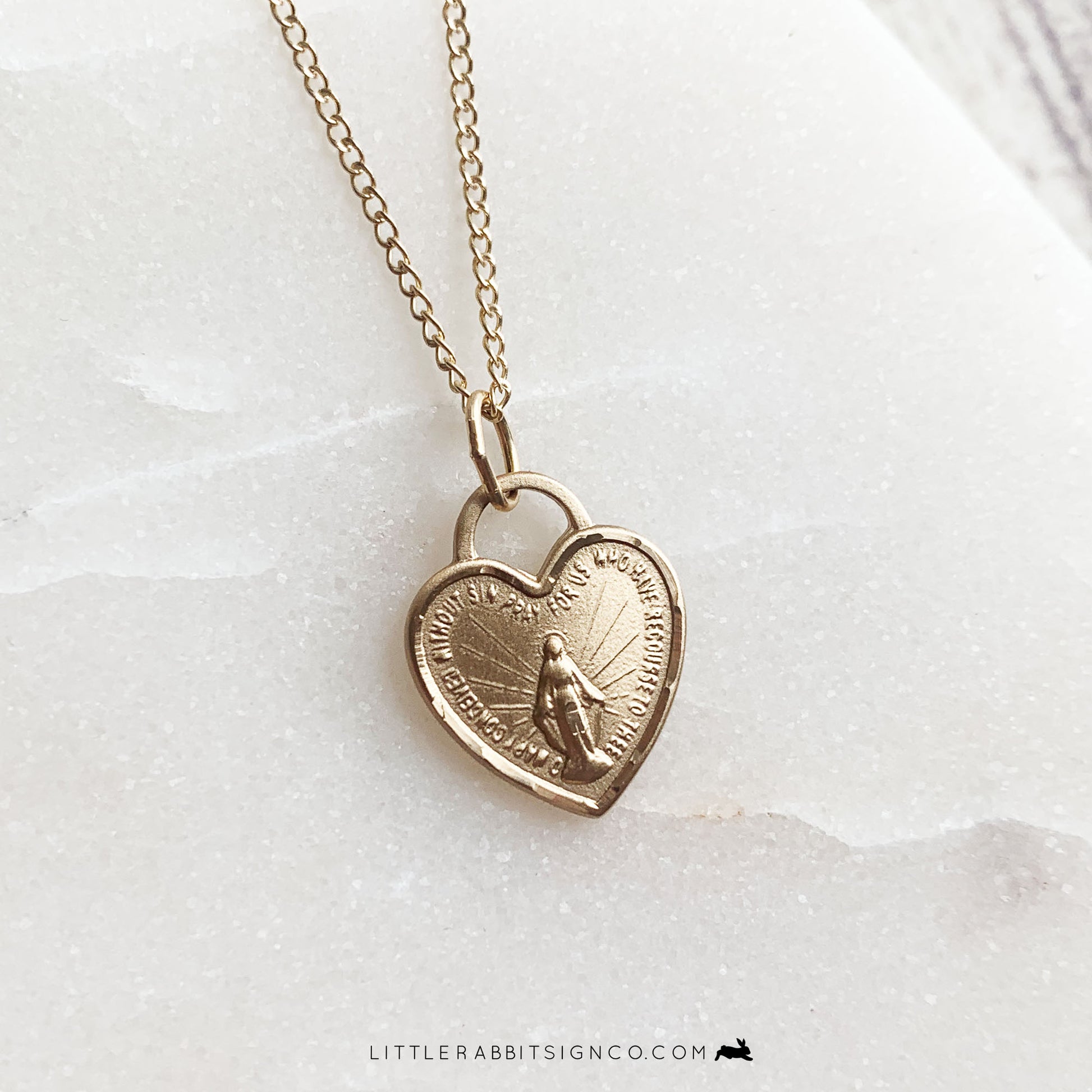 14kt gold filled heart shaped Miraculous Medal pendant close up