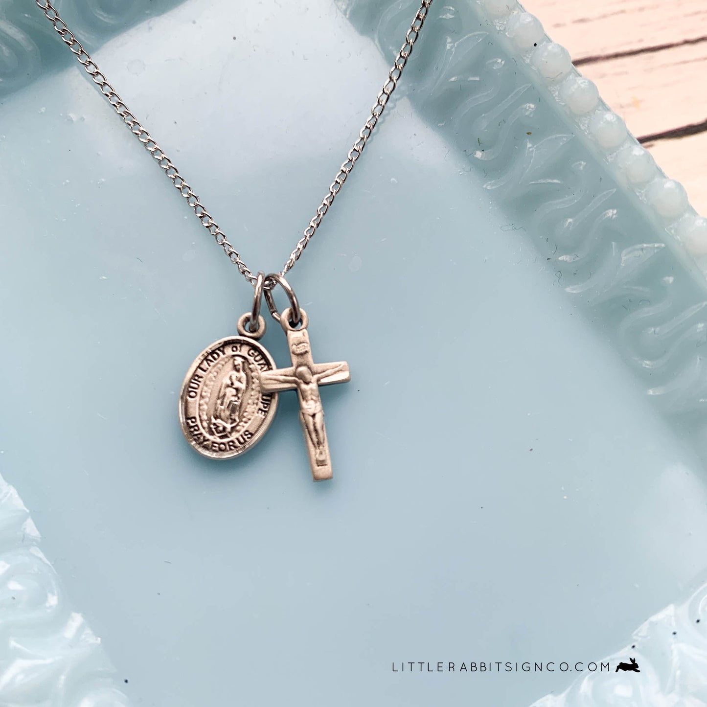 Minimalist Catholic Necklace with Our Lady of Guadalupe and Crucifix paired together on a sterling silver chain.