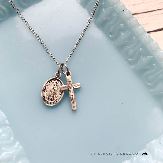 Minimalist Catholic Necklace with Our Lady of Guadalupe and Crucifix paired together on a sterling silver chain.