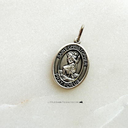 Close up of sterling silver Saint Christopher patron saint medal — classic size Catholic necklace