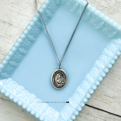 Sterling silver Saint Christopher medal necklace lifestyle shot — Catholic gift for safe travel